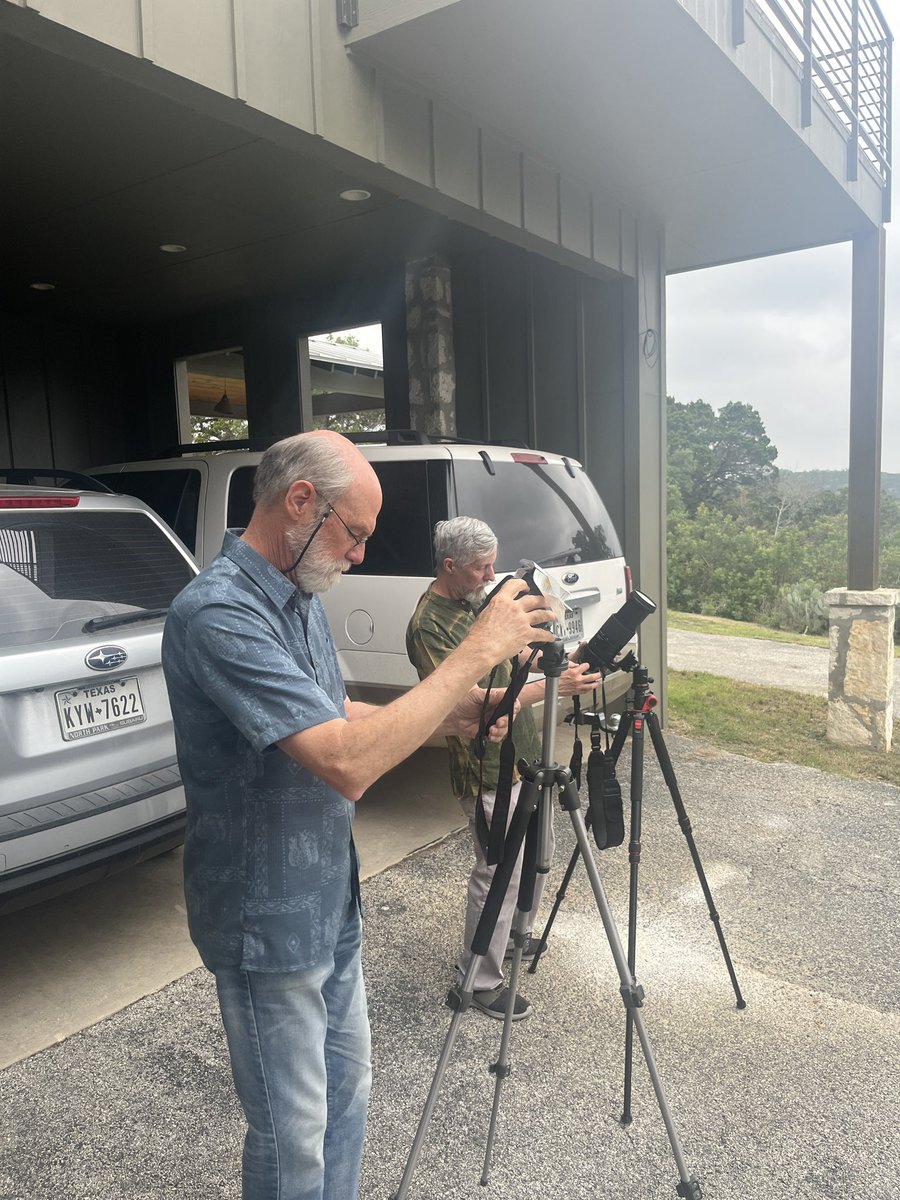 Myron Gerard (L) and Rhyc Sandberg (R) setting up their cameras before the eclipse in Grey Forest, Tx