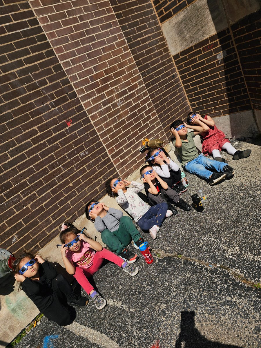 'PreK Room 001 learns about the Total Solar Eclipse with Scholastic Magazine then has the opportunity to view the Eclipse with safety glasses outside!'