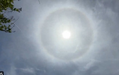 A large black circle surrounds the sun.