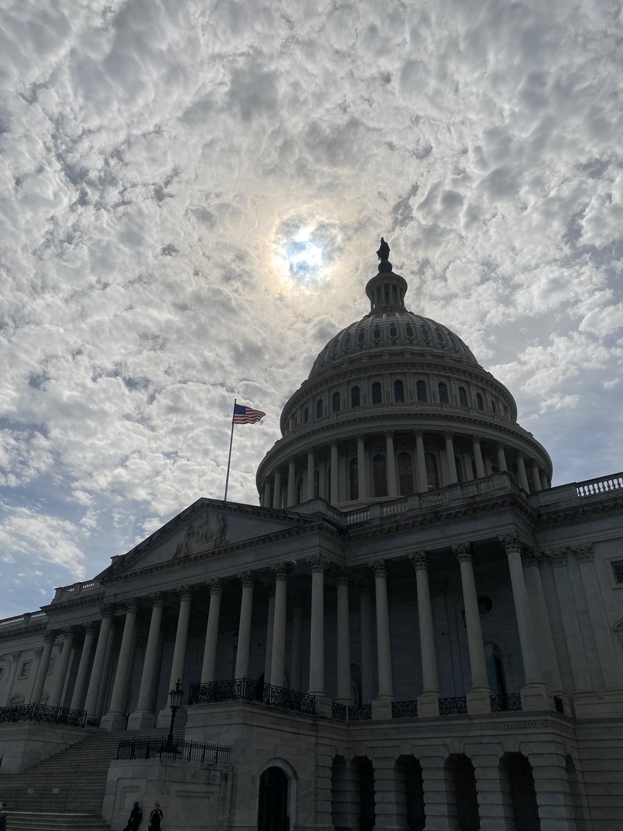 Even a partial eclipse shrouded in clouds looks pretty cool over the nation’s capitol building. #DXEclipse ⁦<a href="/DallasExpress/">The Dallas Express News</a>⁩