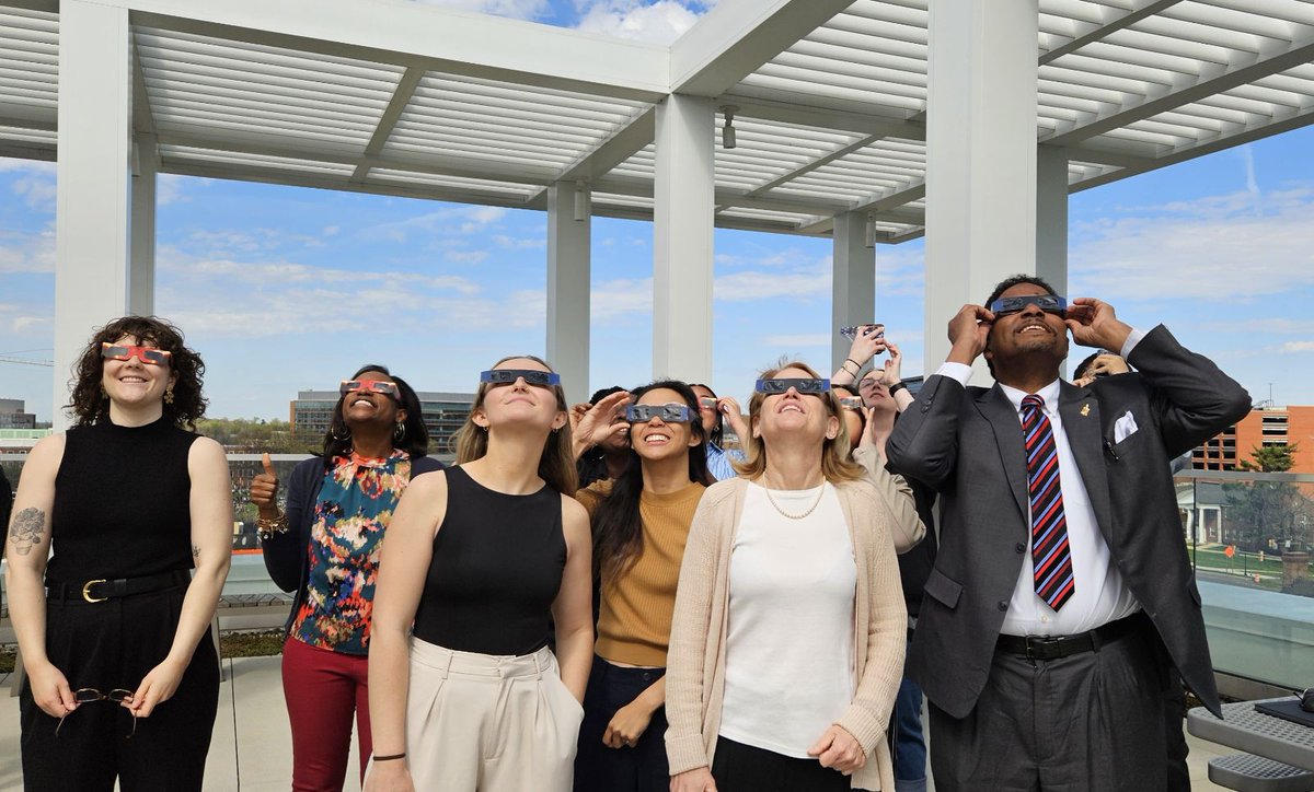 🌚 Look up! Did you see the partial-eclipse today? @President_Pines and Provost Jennifer King Rice joined the @DoGoodUMD team on the terrace of Thurgood Marshall Hall to witness the mesmerizing partial-solar eclipse. 🌝