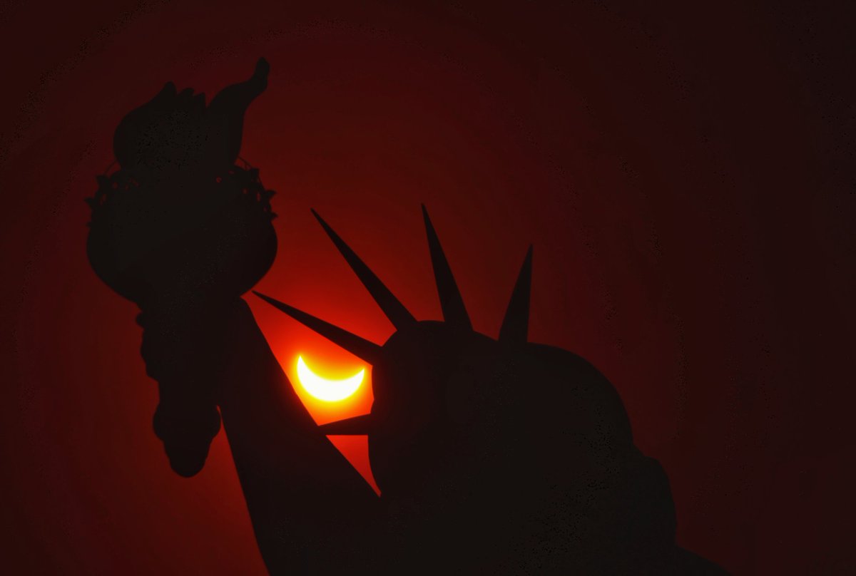 The eclipsed sun passes behind the Statue of Liberty in New York City during the Great American Eclipse in New York City, Monday afternoon #newyorkcity #nyc #newyork #eclipse #Eclipse2024 #statueofliberty @statueellisfdn @statueellisnps