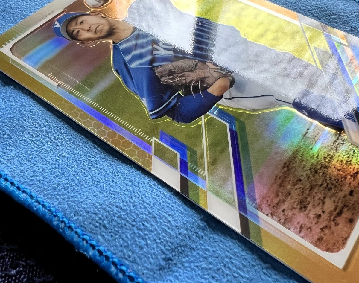 Not fishing for anything nefarious here... This is a 'scratch' that's very close to the surface and hard to see unless you hold it at an angle just right. Is there a way to remove it safely? Such a beautiful card otherwise. @WatchTheBreaks