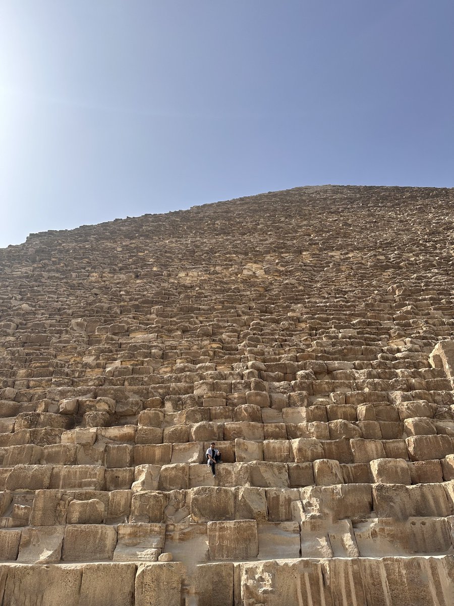 the great pyramid is so much bigger than i thought it was. this perspective of me sitting there is mind blowing.