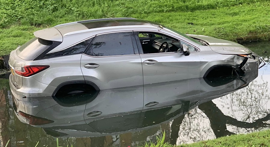 THAMESMEAD: A Lexus RX450h somehow ended up in the canal beside Crossway in Thamesmead around 5am this morning.