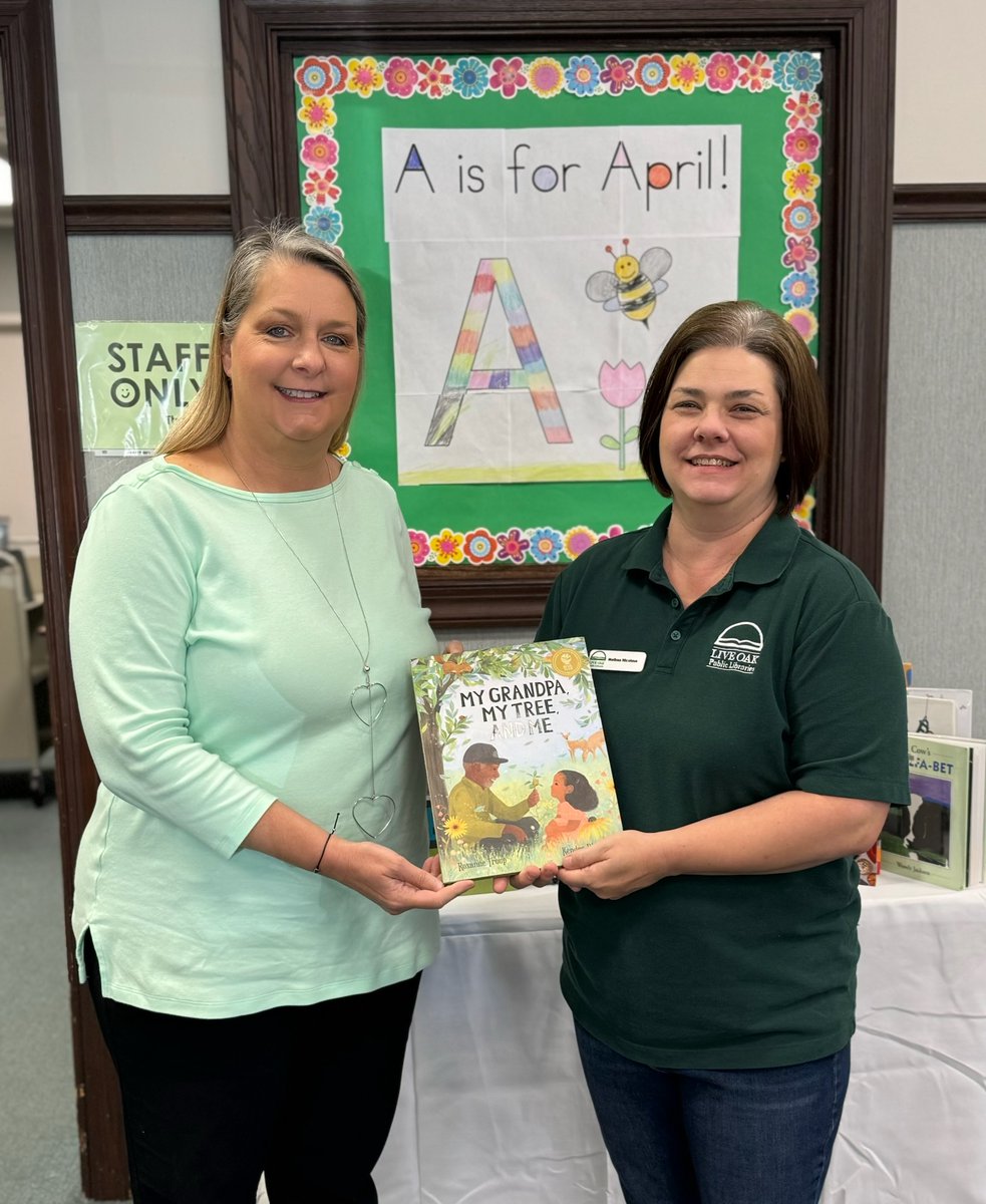 Speaking of community, Theresa Pevey from the Farm Bureau came by last week to donate the book 'My Grandpa, My tree, and Me' by Roxanne Troup, and was kind enough to pose for a photo with Springfield Library Manager Melissa Nicolaus!