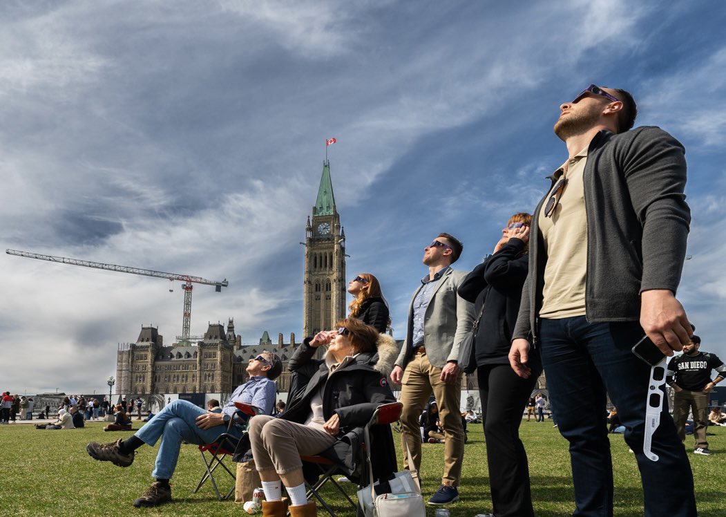 There were quite a few solar eclipse enthusiasts on Parliament Hill this afternoon taking in this rare celestial event.