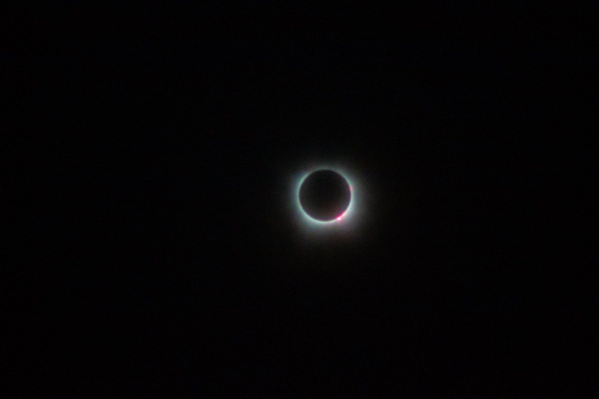 Through a thin veil of clouds.  Austin, TX #Eclipse2024