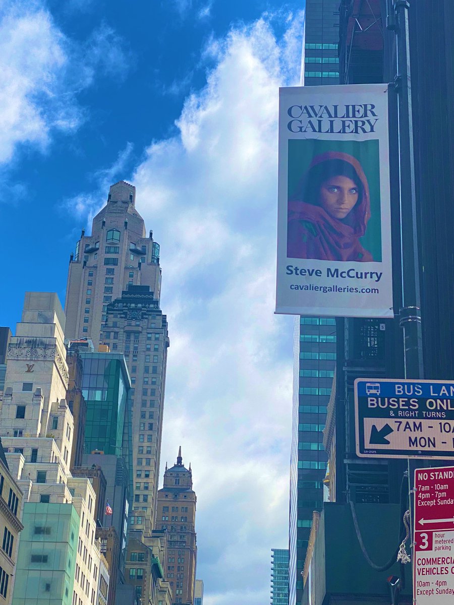Wanted to watch the EclipseSolar without the special glasses , first saw this sign board of Sharbat Gula ( the blue eyes afghan girl ) #EclipseSolar2024 #ColumbusCircle😊