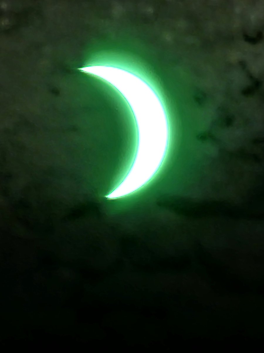 dwbeisner's tweet photo. My best photo of #Eclipse2024 looking through an 11 shade welding helmet at 1:53 pm, about maximum cover for our area. https://t.co/DAceiZz1F2