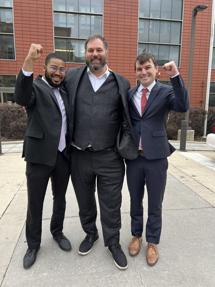 PeoplesLawChi's tweet photo. People’s Law attorneys @Brotha_Hakeem (left) and @BradThomsonNoP (right) celebrate with client Erek Slater after having his criminal charges dismissed!

The judge granted our Motion to Dismiss that Erek’s arrest and prosecution violated the 1st Amendment and Illinois labor law. https://t.co/KnmwUtwpUY