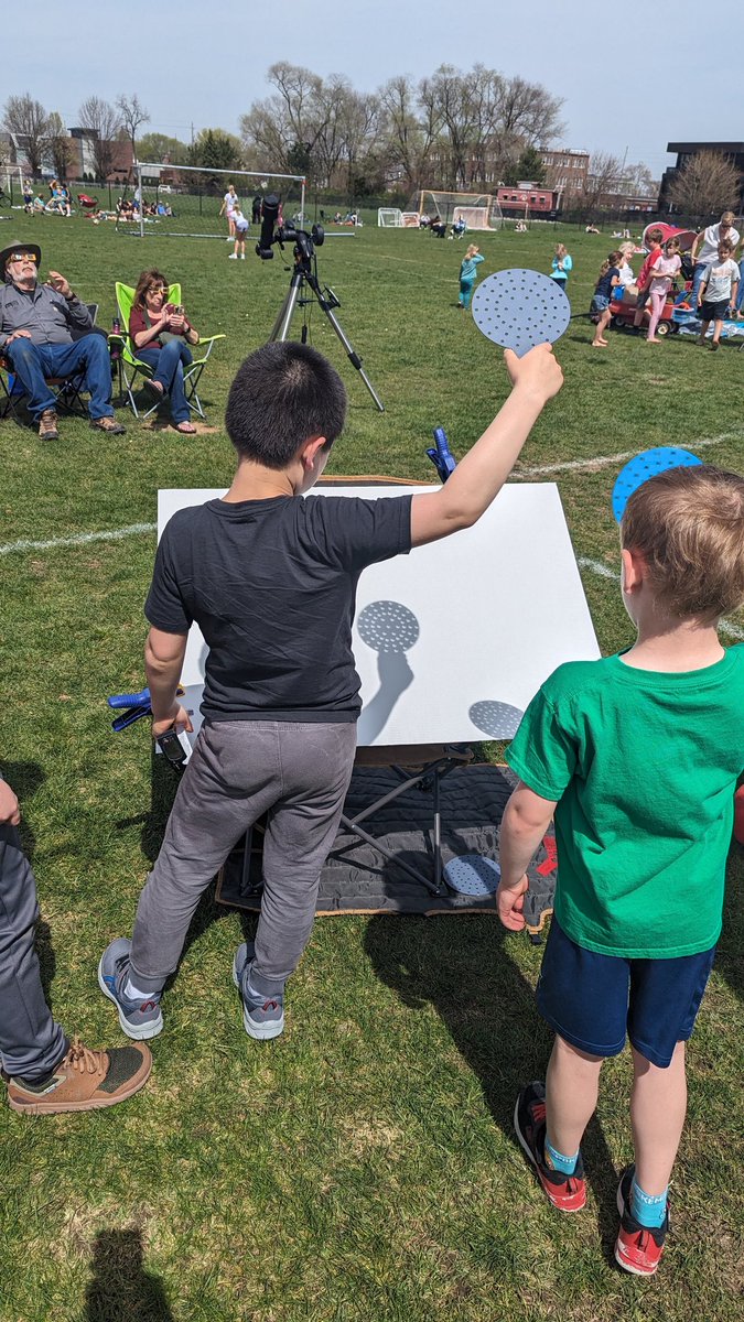 roanders's tweet photo. @smartereveryday Thanks for the inspiration! We set up stations at a local park, and observed (with some new friends) soft/fuzzy shadows, projections, uneasy dogs, temp drop, and faint shadow bands! The app was super helpful (especially the reminder to observe the horizon). https://t.co/MRdOln7xkA