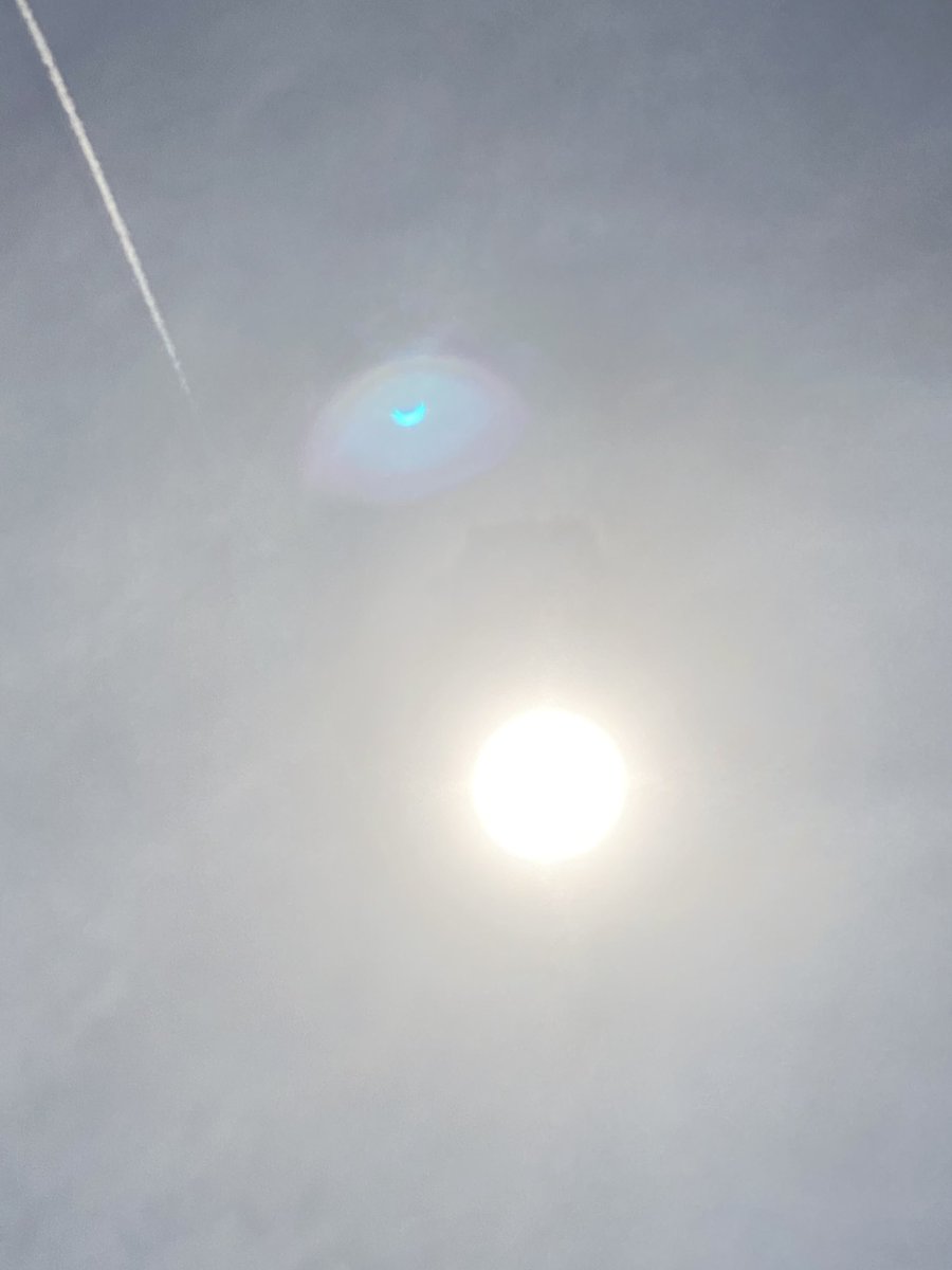 Sunspots are usually annoying in images. In this case the spot shows the eclipse much better and in blue. Gainesville, Florida 3pm. iphone 11.