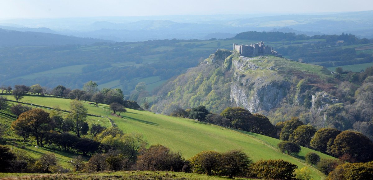 Carreg Cennen Castle is a castle sited on a high rocky outcrop overlooking the River Cennen, close to the village of Trap, four miles south east of Llandeilo in Carmarthenshire, Wales. Wikipedia, NMP.