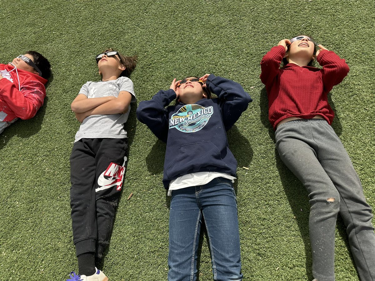 CGaillour's tweet photo. GOK students catching a glimpse of the solar eclipse today! #OneGOK 🐏🌙 https://t.co/nzzMrSDrZg