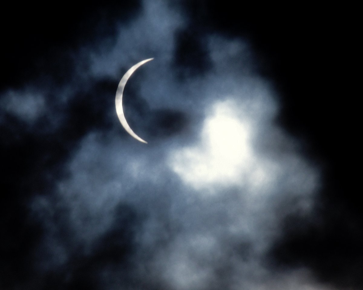 Eclipse today though the clouds above East PA. Nikon D750 F11 1/800 with a polarizer filter.