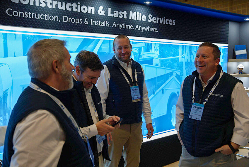 A team of corporate staff share a laugh during the TechAdvantage Expo in San Antonio, Texas in March. From left, Matt, Perry, Adam and Douglas are having fun making key connections and partnerships with other people in the industry.