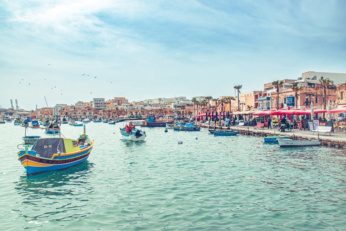 Traditional 'Luzzu' fishing boats decorate the harbour of Marsaxlokk on the island of Malta. postcardsfromamancunian.blogspot.com/2024/04/drive-… #travelblogger #photography #travelbloggers #travelphotography #blogger #Valletta #Malta #VisitMalta
