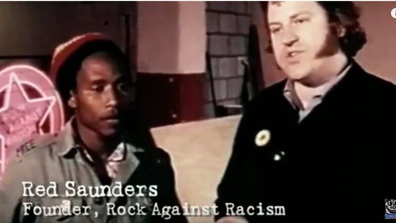 Red Saunders (on the right) gives this reply to Eric Clapton: “Come on Eric, own up. Half your music is black. You’re rock music’s biggest colonist. You’re a good musician but where would you be without the blues and R&B? Who shot the Sheriff, Eric? It sure as hell wasn’t you.”