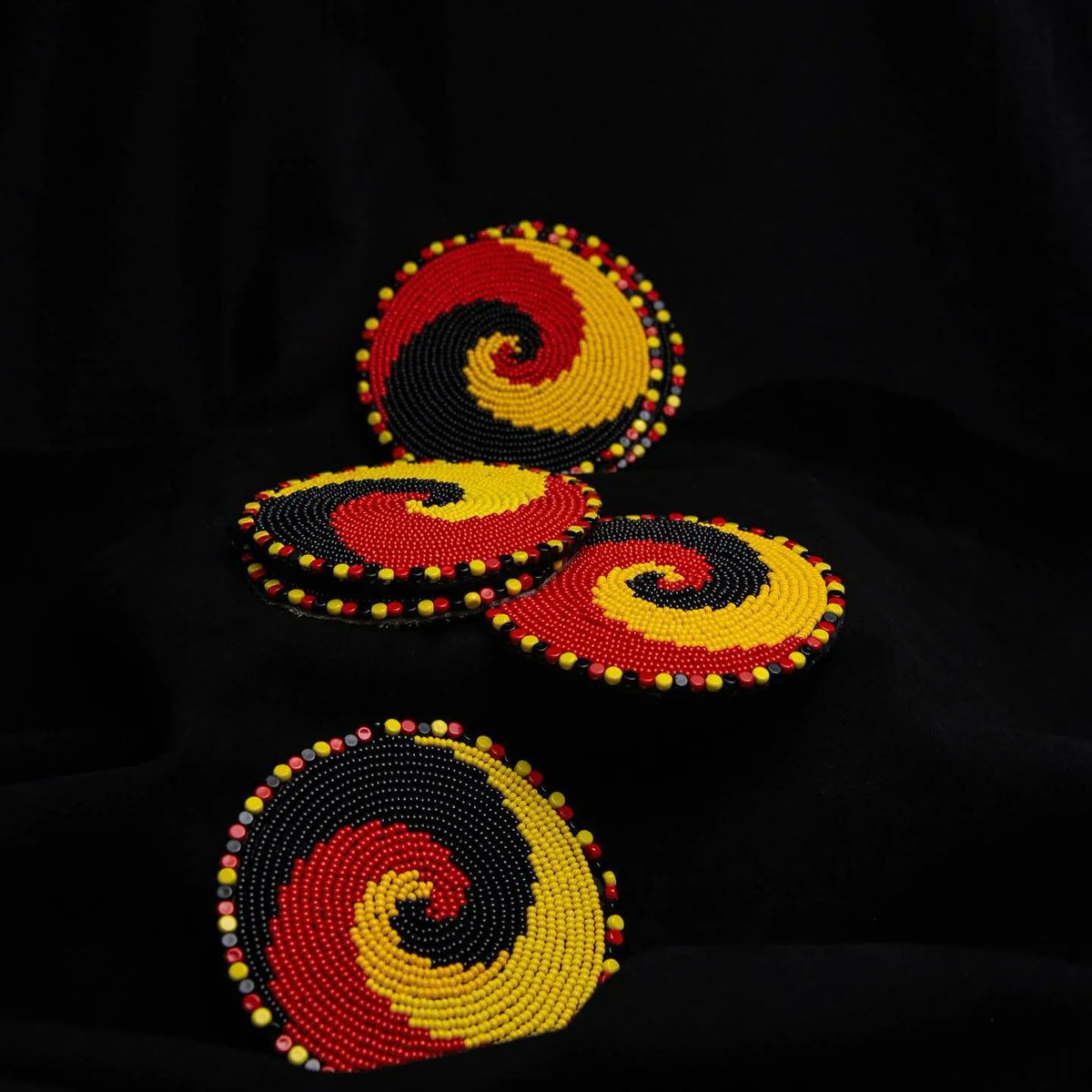 West-Pokot traditional  beadwork - inspired coasters.
Traditional Pokot beadwork is elaborate and full on color including; red, yellow, white and black. 
They normally use larger beads and elaborate patterns to make their pieces.

#UshangaKe 
#Nunuashangajengamama 
#Beadwork