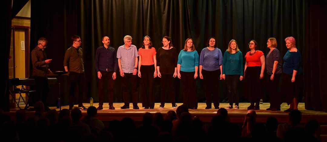 Quote Tweet with a picture of you enjoying a hobby. I guess Accapella would have to be mine. This was our last concert (I'm in the middle in light blue)