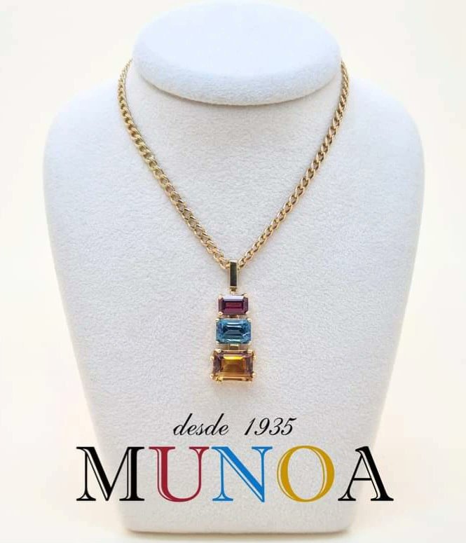 A joyful combination of #rhodolitegarnet, #bluetopaz and palmeira #citrinequartz, mounted in 18k yellow gold. Since 1935, Casa Munoa designs and creates high quality #jewellery and offers a careful service attended by the best professionals. #necklace #finejewelry #jewellery