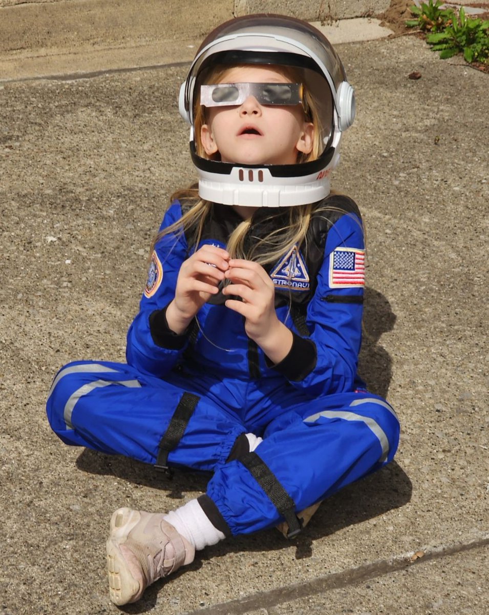 This is how my kid watched the eclipse yesterday, and I really hope she never loses her sense of wonder and awe in the cosmos...