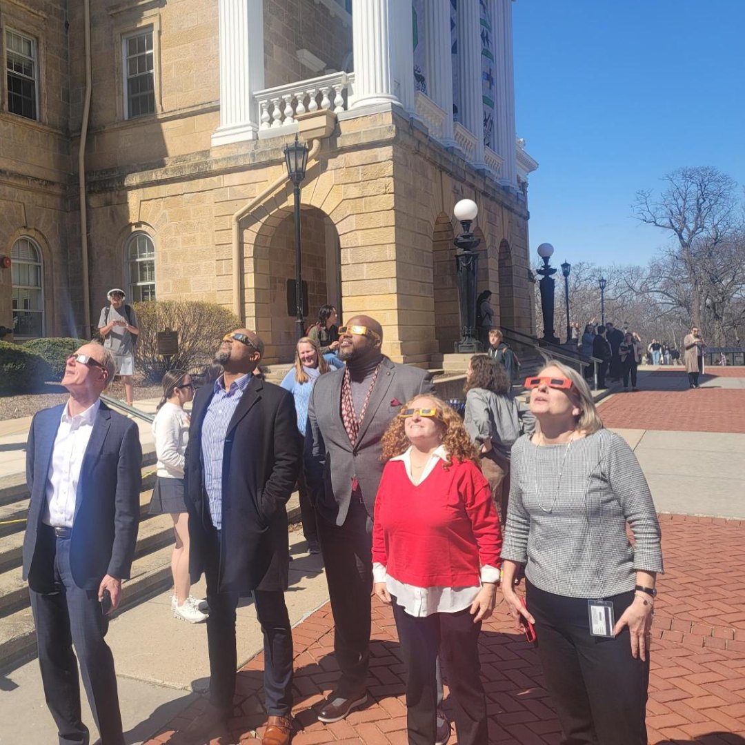 The Chancellor (@uwchancellor) invited me to an impromptu partial eclipse viewing party outside Bascom Hall yesterday, and I couldn't pass up the invitation. How cool to experience this celestial magic with my colleagues! #PartialEclipse