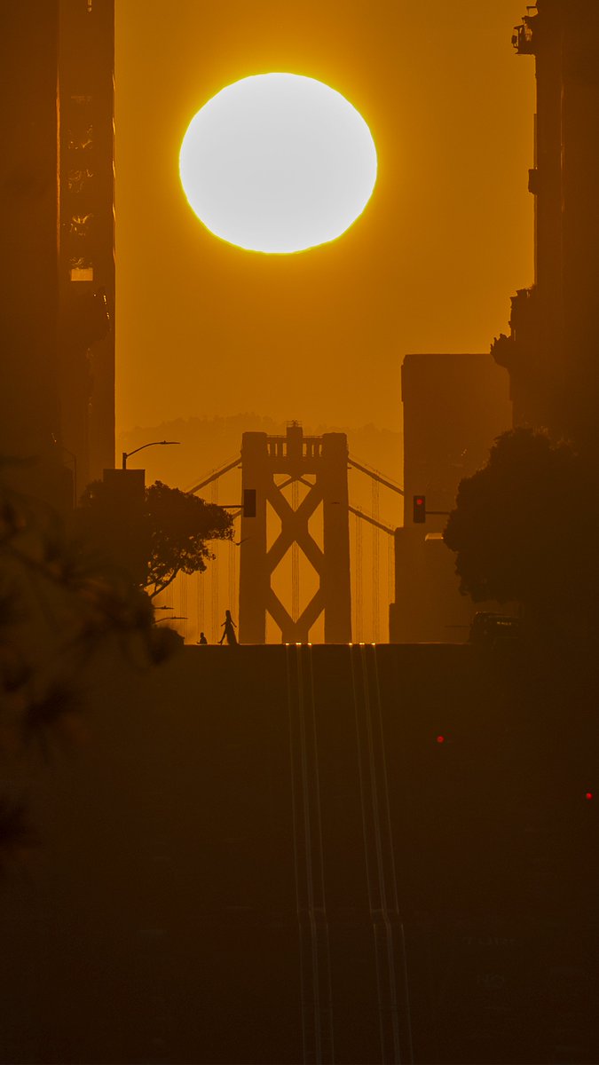 The sun rises over the Bay Bridge in a biannual alignment known as the California Henge in San Francisco, California on Tuesday April 9, 2024