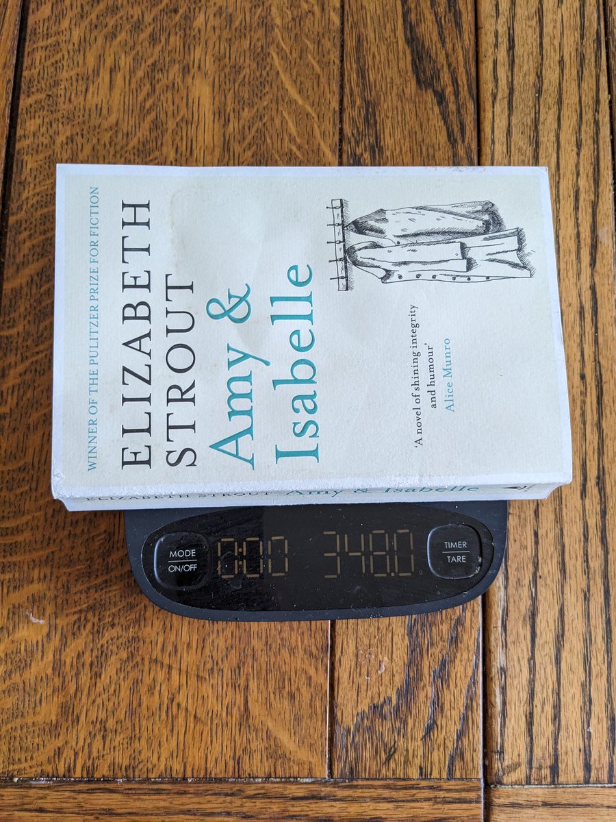 Just me weighing the average paperback so I can calculate exactly how many books I can buy on my trip to NYC tomorrow without going over my luggage allowance.