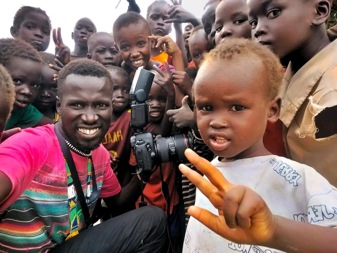 The children in this picture were in awe of my artwork and camera. It is my hope that seeing this Happiness will inspire them to one day become photojournalists. #SSOX #SSOT #SouthSudan