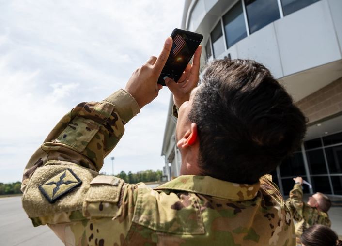 Chief Warrant Officer 2 Bryan Cerrato, #Arkansas #Army #NationalGuard, uses eclipse glasses taped to his phone to photograph the start of the solar #eclipse April 8th … dvidshub.net/r/yxwaij