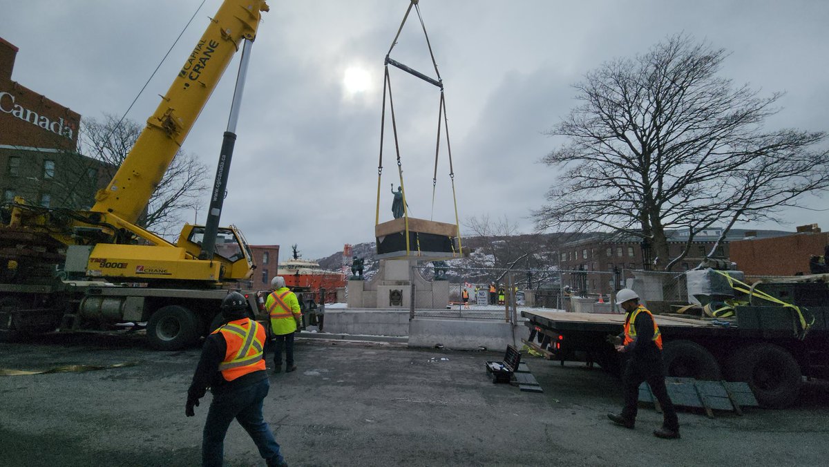 VOCMNEWS's tweet photo. At the War Memorial in downtown St. John's where the Tomb of the Unknown Soldier was just lifted off a flatbed and placed at the site. https://t.co/TjaMS7MrXp