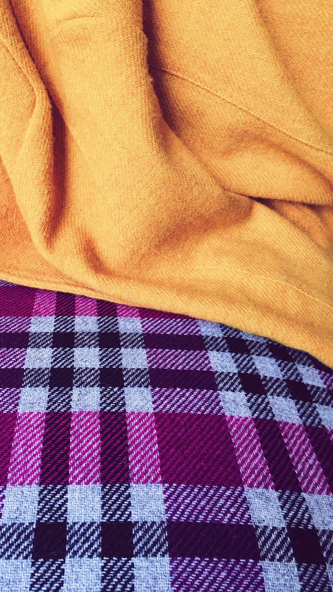 This or That? Do you lean towards the understated Harris Tweed® fabric at the top, or do the bold purple hues and pattern beneath catch your eye? #HarrisTweed #thisorthat #understated #mustard #purple #pattern #check #handmade #craft #weaving #traditional 📸 Encompass-ID