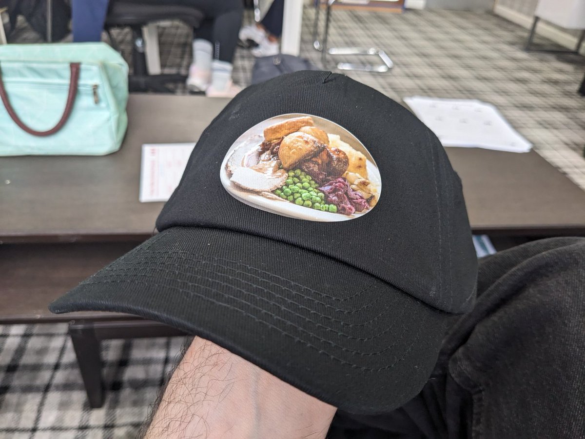 A school I'm visiting has given me a baseball cap with a picture of a roast dinner on it and I've honestly never been happier