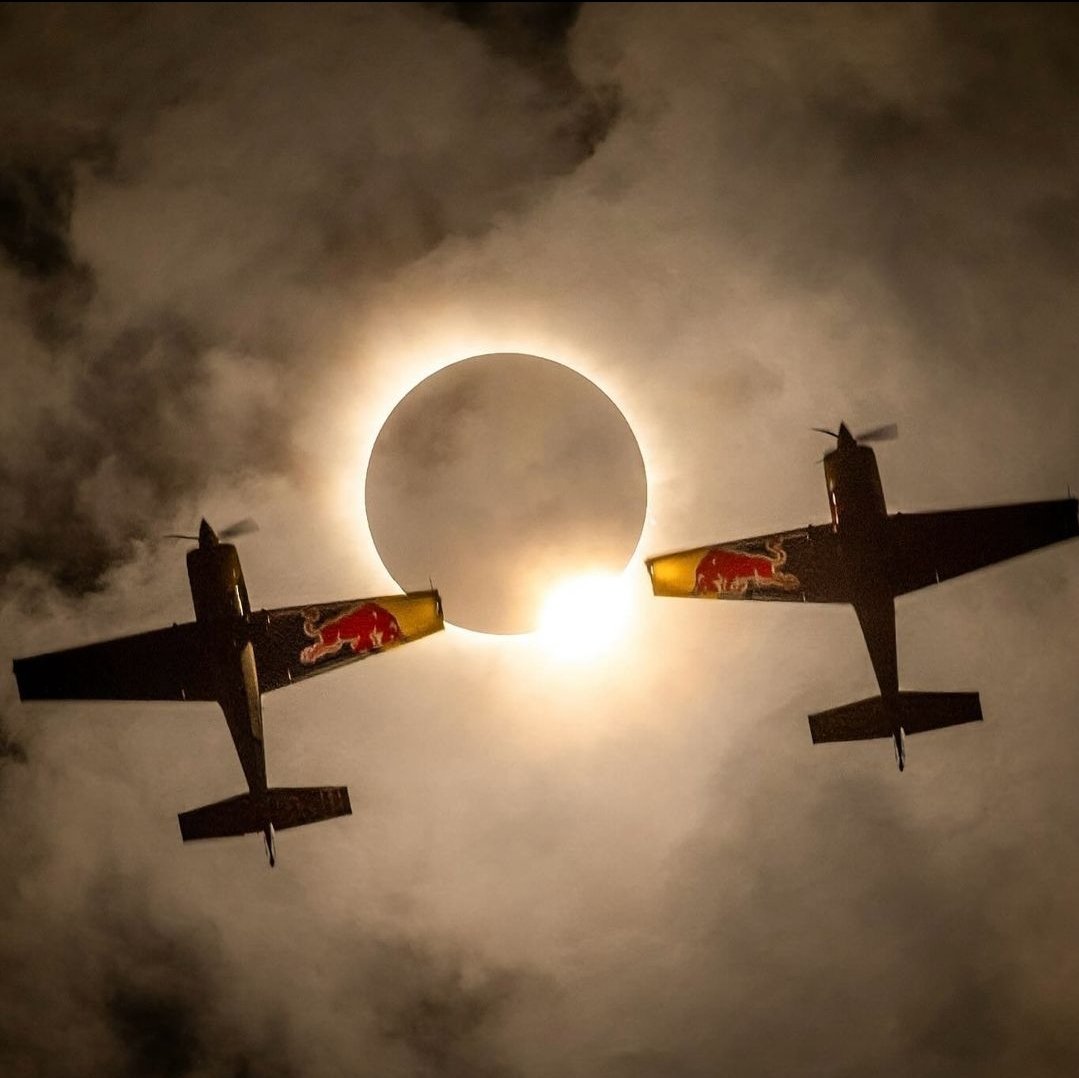 We should have known Red Bull would get epic photos of the solar eclipse by putting two aerobatic pilots 1,500 feet in the air and asking them to fly just 4 feet apart 🤯