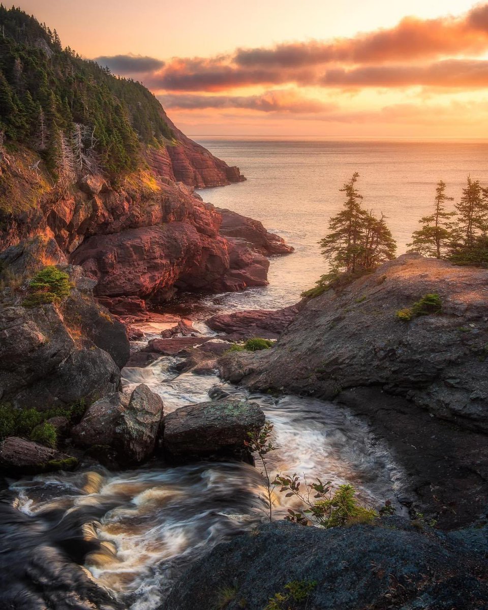 A river leading down over Flatrock Falls toward the ocean. A wonderful view on a warm summers morning! #newfoundland #explorenl