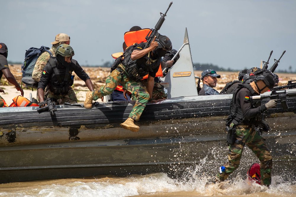 USSOCAF's tweet photo. Members of the @GhArmedForces jump off a boat to take up fighting positions on a beach during #Flintlock23 in Volta, Ghana.
Flintlock is @USAfricaCommand's premier and largest annual special operations exercise that strengthens key partner nations throughout Africa. https://t.co/pbA7ZPk2Rr