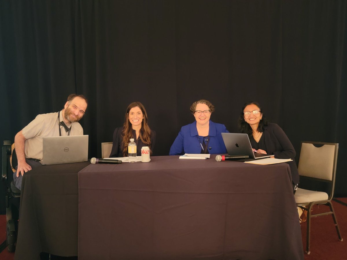 The team debating the resolution of the best response to Intimate Partner Violence, prior to the debate.  All smiles!