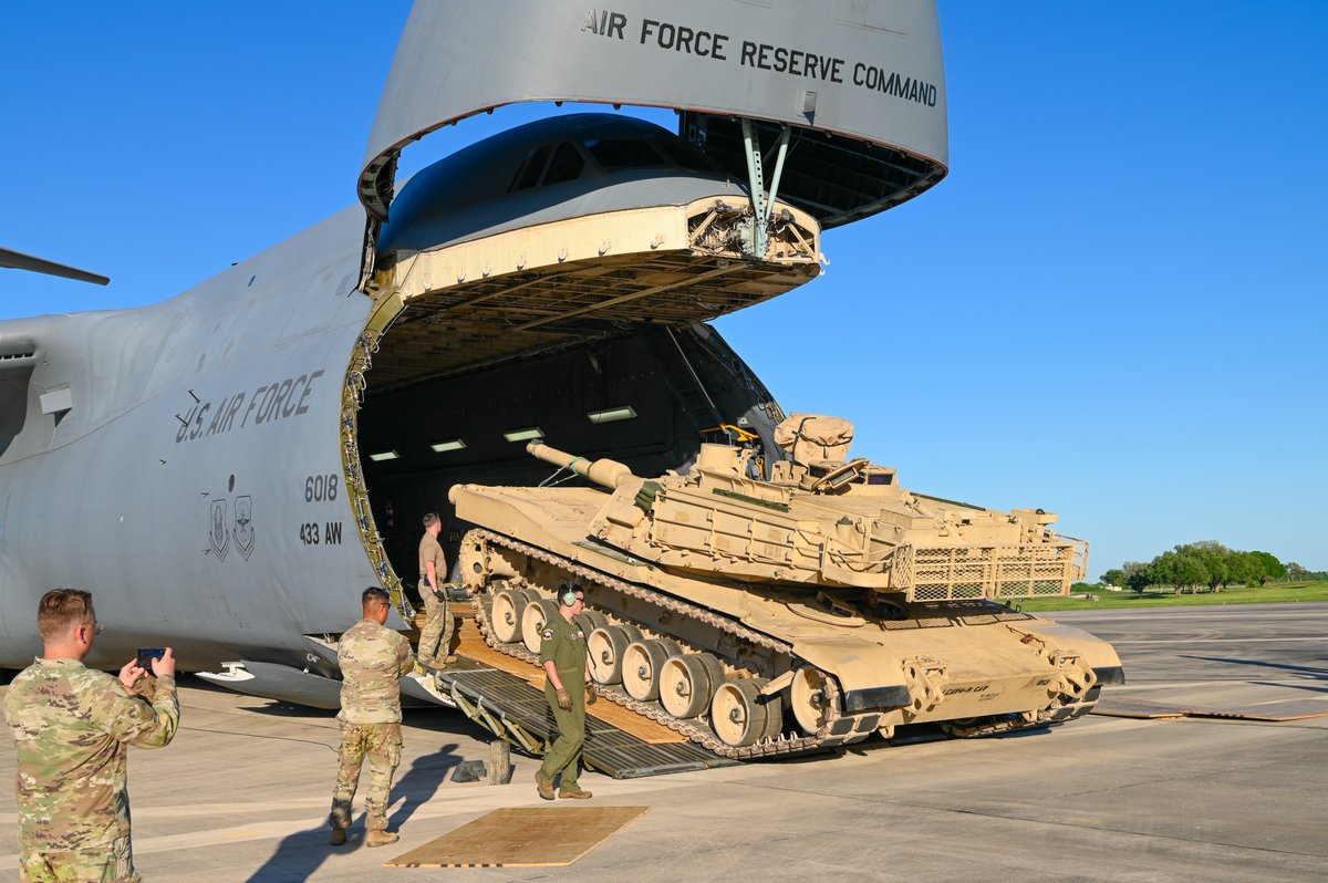 Airmen and Soldiers work together to unload a M1A2 Abrams Main Battle Tank from a C-5M Super Galaxy at Joint Base San Antonio-Randolph, Texas on April 4th, 2024. (U.S. Air Force photo by Julian Hernandez)