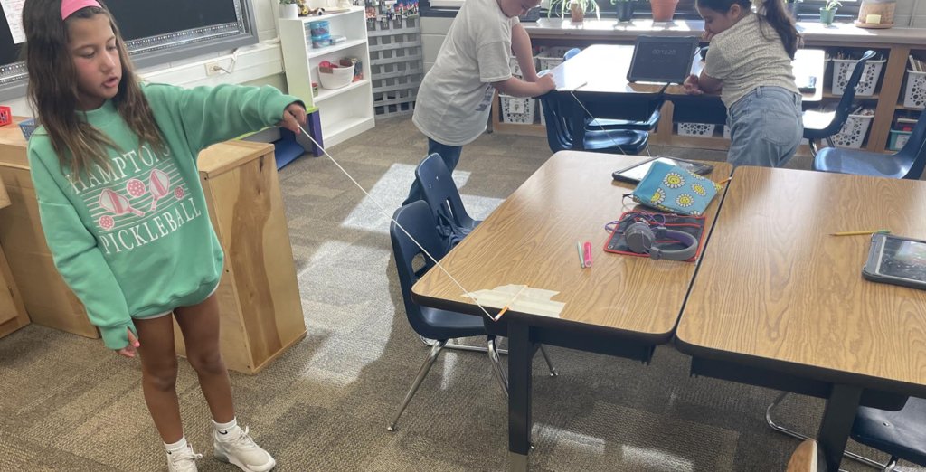 The 3rd-grade pendulum experiments are in full swing @WaukeshaSTEM. How do gravity and force affect the motion of an object? #SCIENCE #Collaborate