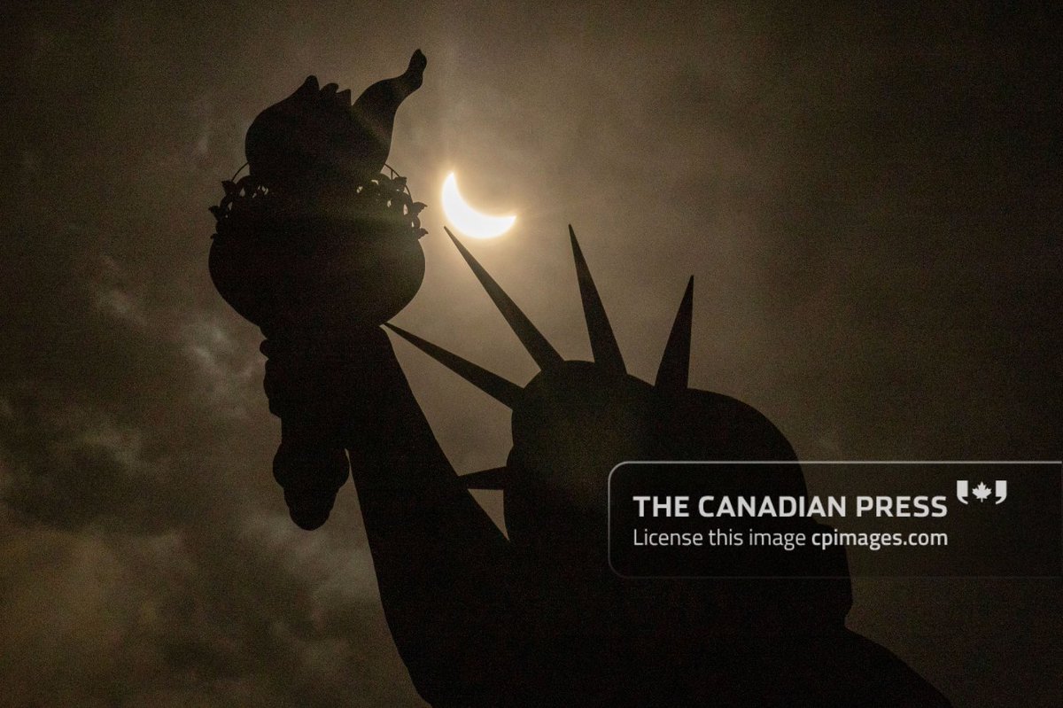 In today's image from our partners at the Associated Press (bit.ly/cpimagestw), the moon partially covers the sun behind the Statue of Liberty during the total solar eclipse on Liberty Island, Monday, April. 8, 2024, in New York. AP Photo/Yuki Iwamura