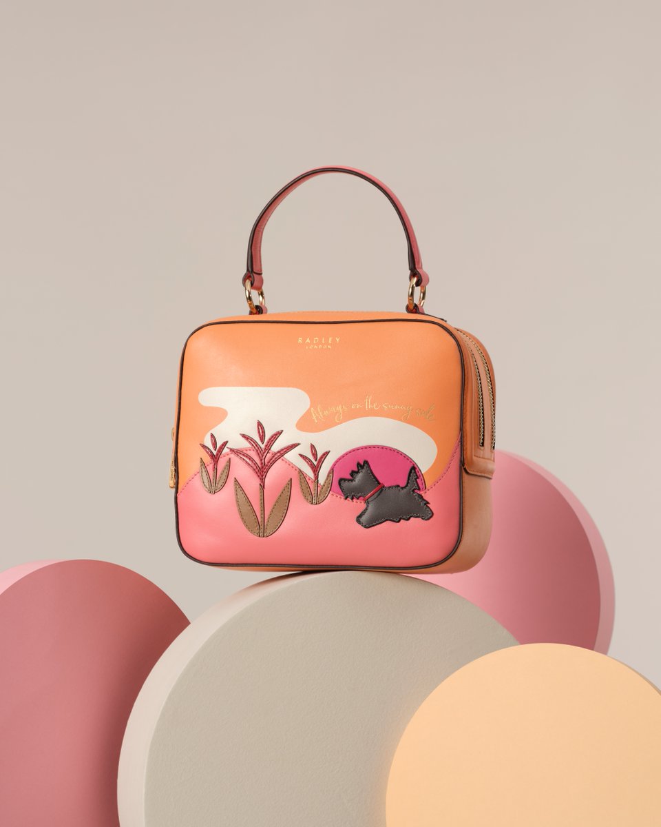 Bringing the sunshine. Our Spring Street bag brightens up every look with its colourful leather appliqué scene. bit.ly/4awOkNh