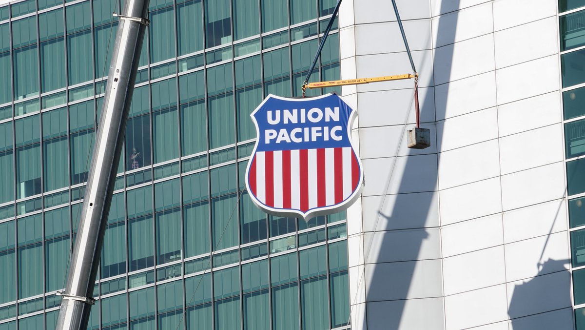 Union Pacific Center in Omaha, Nebraska received new building signage today. The UP shield was installed this morning by crane.