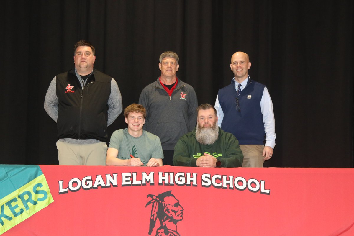 Logan Elm senior Keegan Kidd recently signed to continue Swimming and Running Track at Wilmington College. Keegan is seated with dad, Jody Kidd. Standing are LE athletic director Eric Karshner, Swimming and Track Coach, Chad Conley and LE principal Nate Smith.