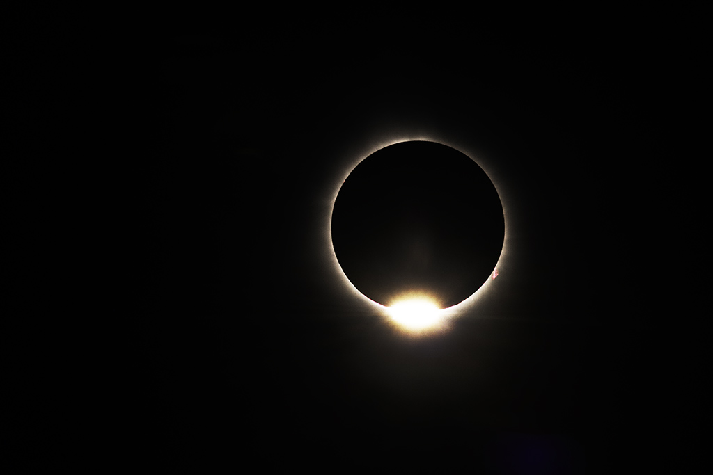 Total solar eclipse diamond ring appears at the edge of the moon at the end of totality. Lake Willoughby North Beach, Northeast Kingdom of Vermont, April 8th, 2024. Good light and happy photo making! RothGalleries.com #solareclipse #solareclipse2024 #photography #Vermont