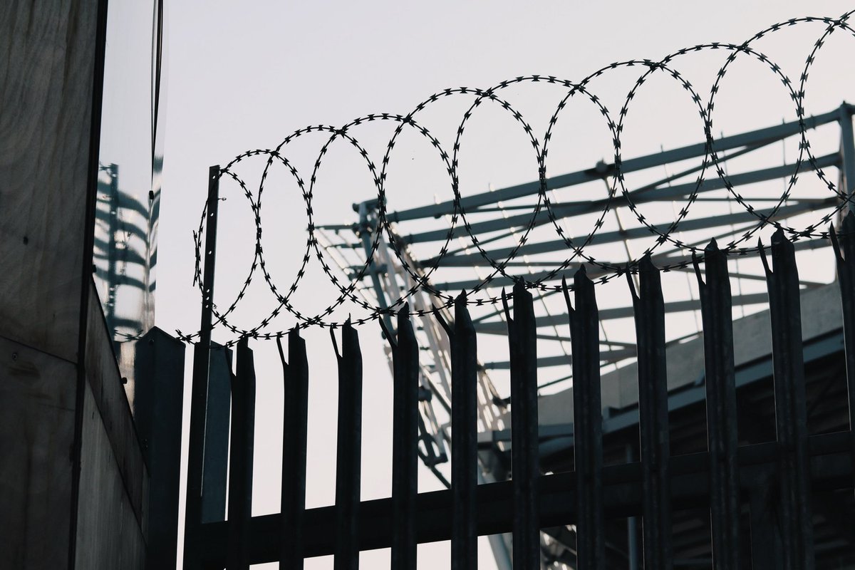 Everton Stadium through barbed wire Regent Road Summer 2023