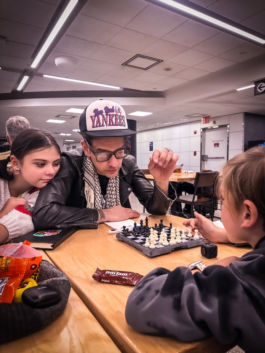 Tour Day One. A little pre-flight chess as we wait to board the plane. Bear was overjoyed to find a leftover TimTam in his backpack from our Australia trip! It’s the little things that keep us sane(ish.) 🚀🧳🙌 #itsafamilybusiness #wetraveltogether See you soon, Cali!