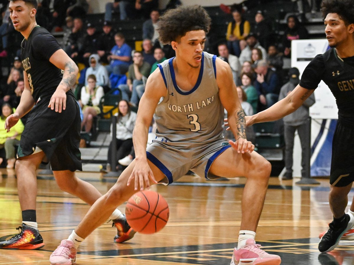 Dallas College North Lake men's basketball player Jakob Zenon slides his feet as he dribbles into the paint area. Zenon was named a Nationa Junior College Athletic Association Division III  First Team All-American. 