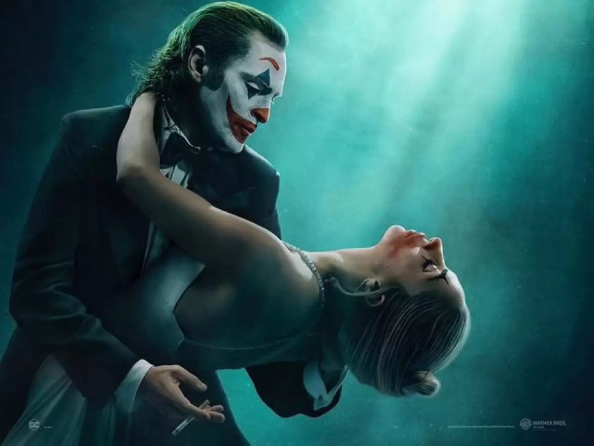 Footage of Joker: Folie à Deux in Warner Bros’ sizzle reel includes shots of Lady Gaga and Joaquin Phoenix blowing smoke at one another through a jail cell and the pair dancing in the rain.